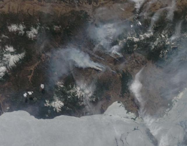 Russian wildfire burning on the shores of still frozen Lake Baikal April 23 2014